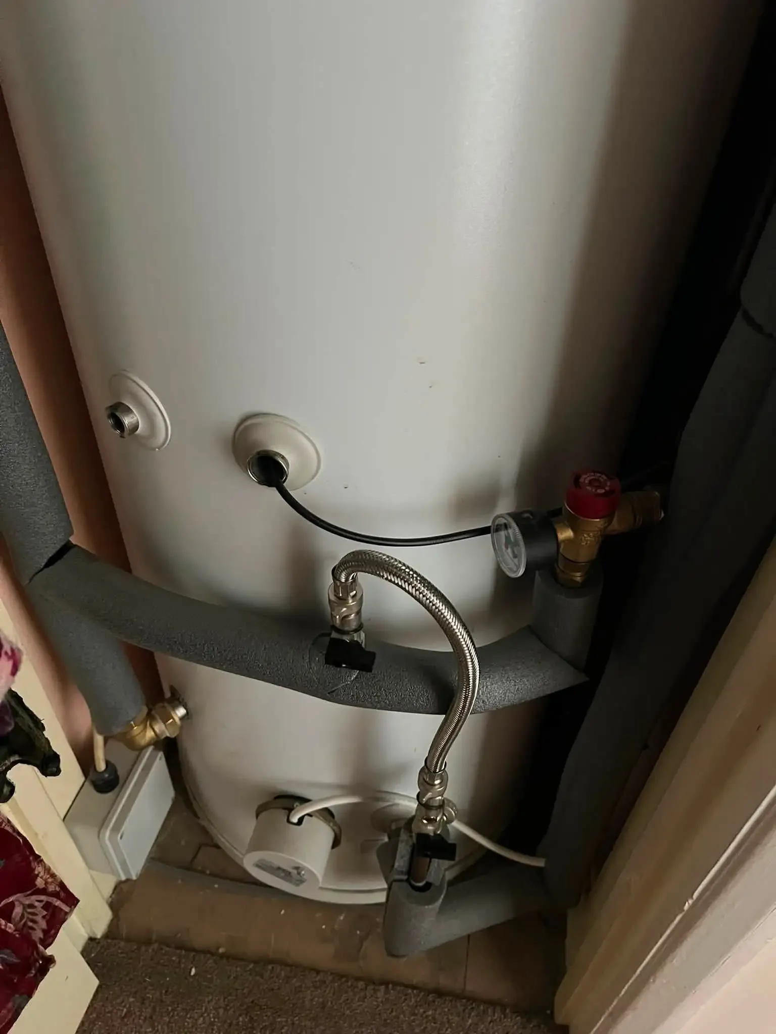 Certified technician diagnosing water heater connections in Killeen TX